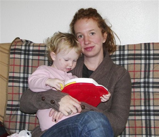 In this undated photo provided by Emily Gillette, she is shown with daughter, River. Gillette, who was asked to leave an airplane for breast-feeding her child in 2006, sparking a day of airport protests nationwide, has reached an out-of-court settlement with the airlines she sued. 